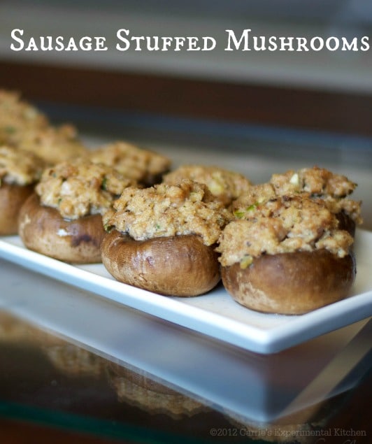 A close up of a tray of food, with Mushroom and Sausage