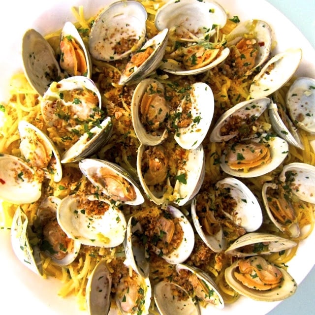 A variety of food on a plate, with Seafood and Clam
