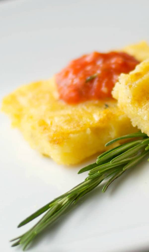 Italian Polenta made with yellow cornmeal, sea salt and fresh rosemary; then grilled and topped with a Roasted Roma Tomato Coulis.