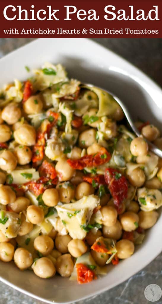 Chick pea salad with marinated artichokes and sun dried tomatoes in a vinaigrette made with fresh lemon juice and extra virgin olive oil.