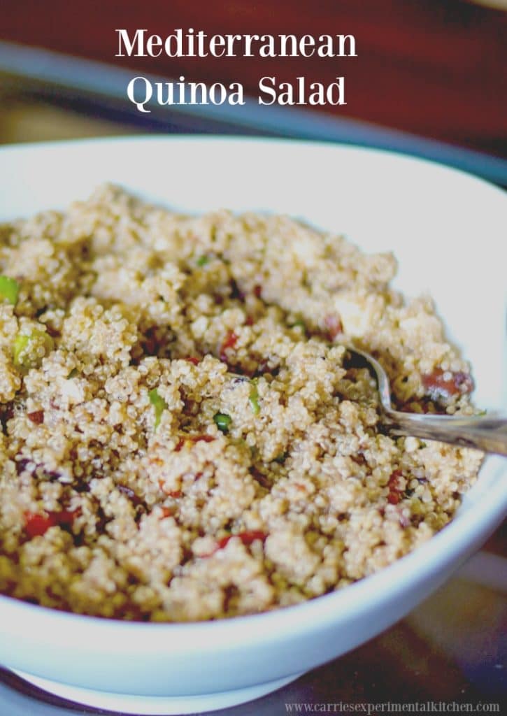 A bowl of food on a plate, with Quinoa salad