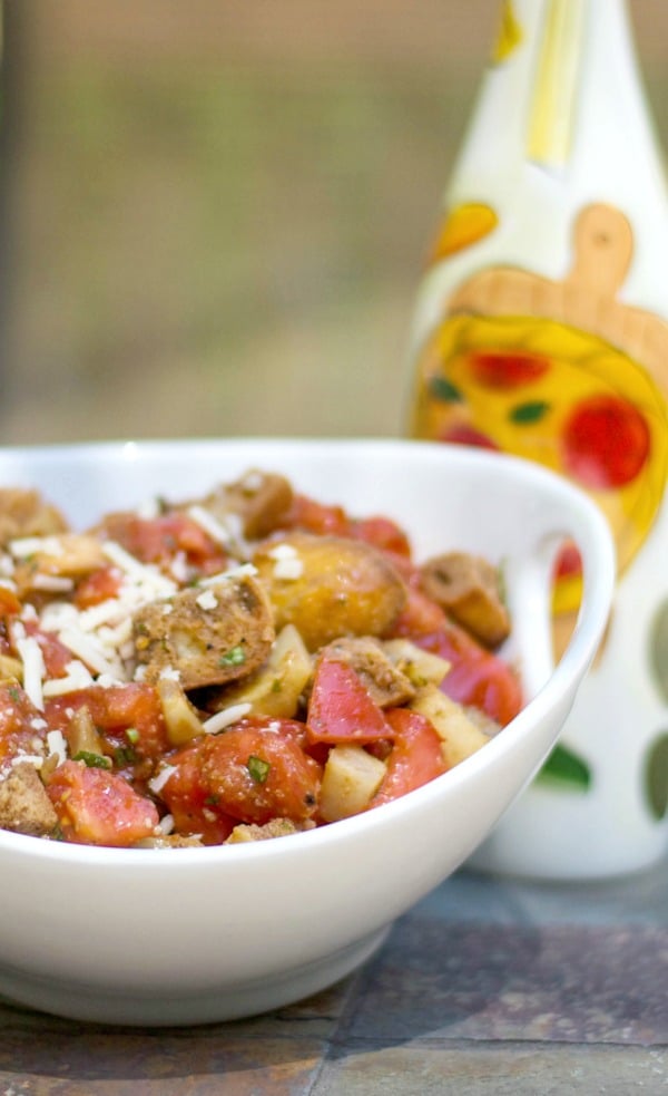 A close up of fennel and tomato panzanella salad