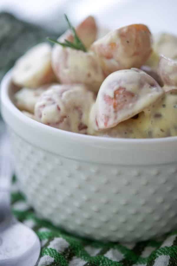 A close up of a bowl with dijon red bliss potato salad