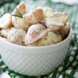 Dijon Red Bliss Potato Salad in white serving bowl