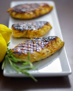 A plate of food on a table, with Chicken and Lemon