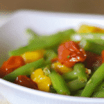 Roasted Grape Tomato and Green Bean Salad tossed with red and green tomatoes, leeks and garlic in a light Lemon Basil Vinaigrette.