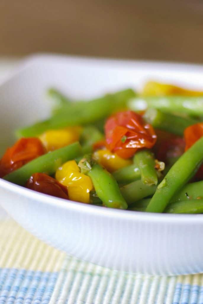 Roasted Grape Tomato and Green Bean Salad tossed with red and green tomatoes, leeks and garlic in a light Lemon Basil Vinaigrette.