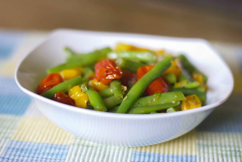 Roasted Grape Tomato and Green Bean Salad tossed with red and green tomatoes, leeks and garlic in a light Lemon Basil Vinaigrette