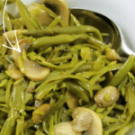 a bowl of french green beans with mushrooms