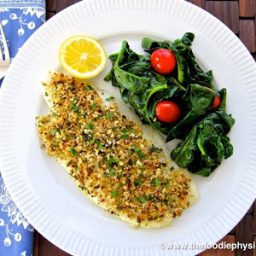 A plate of food on a table, with Flounder Oreganata