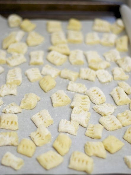 A close up of food on a table, with Gnocchi and Potato