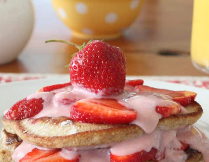 A plate of food on a table, with Pancake and Strawberry