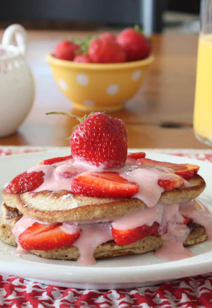 A plate of food on a table, with Pancake and Strawberry