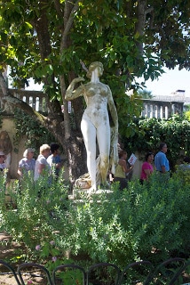 A group of people standing in front of statue in Corfu