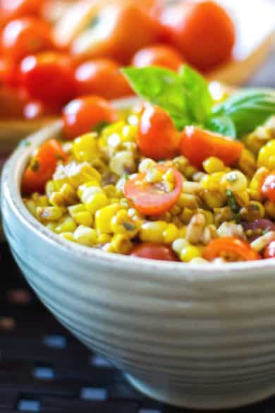 Corn and Tomato Salad made with fresh corn on the cob and garden cherry tomatoes tossed with aged balsamic vinegar and extra virgin olive oil.