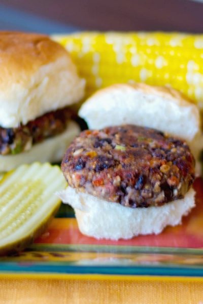 Greek Black Bean Sliders made with black beans, oregano, sun dried tomatoes, mushrooms, oats and Feta cheese are a heart healthy, tasty meatless lunch or dinner idea. 