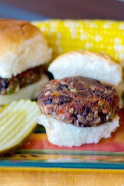 A close up of greek black bean sliders