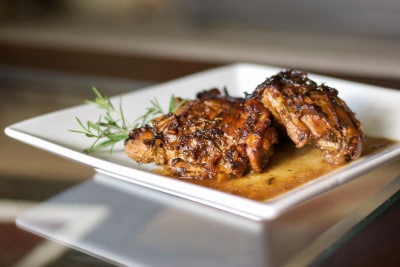 Chicken Balsamico on a white square plate. 