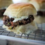 a close up of a greek black bean slider