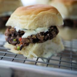 a close up of a greek black bean slider