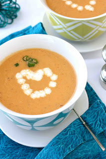 A cup of coffee on a table, with Bisque and Seafood