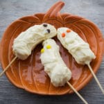 Banana Mummies on a pumpkin plate.