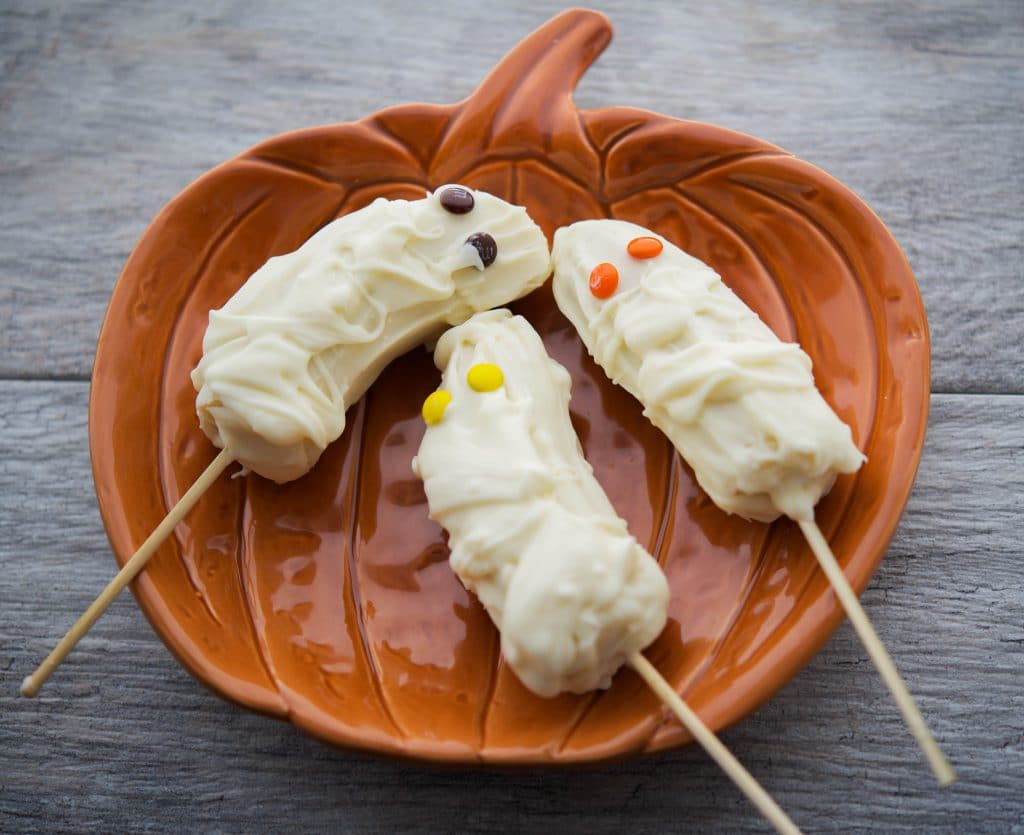 Banana Mummies on a pumpkin plate. 