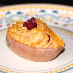 Sweet potatoes cooked until tender; then mixed with cranberry goat cheese, cinnamon, butter, brown sugar and baked again.