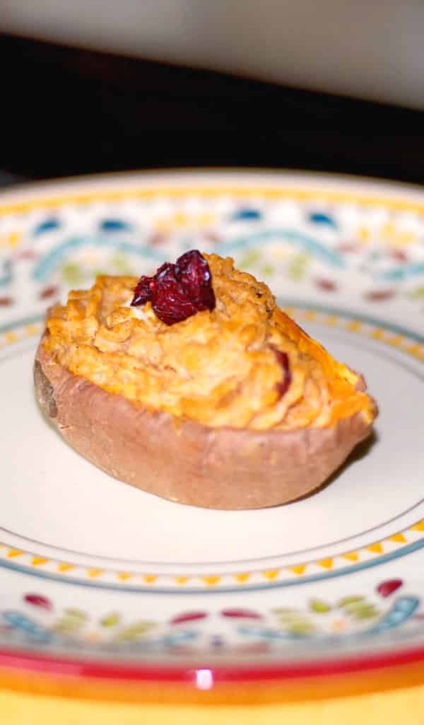 Sweet potatoes cooked until tender; then mixed with cranberry goat cheese, cinnamon, butter, brown sugar and baked again.