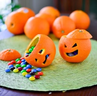 A group of oranges on a table