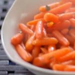 Steamed petite carrots tossed with butter, maple syrup and fresh, chopped sage.