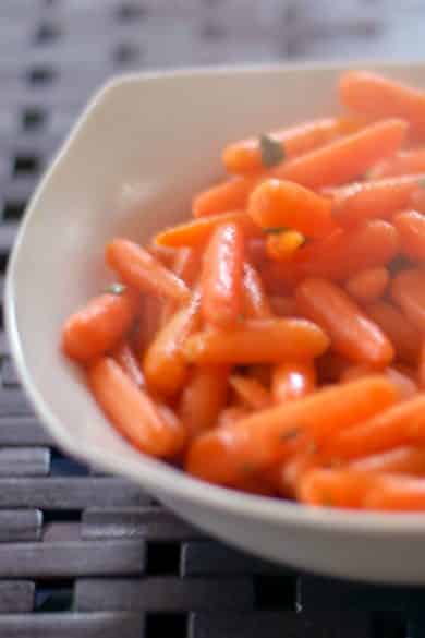 Steamed petite carrots tossed with butter, maple syrup and fresh, chopped sage.