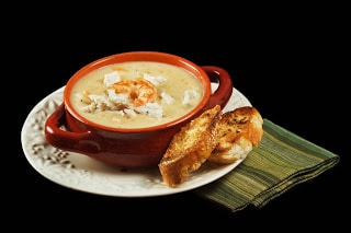 A plate of food on a table, with Chowder and Shrimp