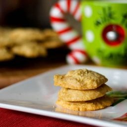 A close up of eggnog cookies on a plate.