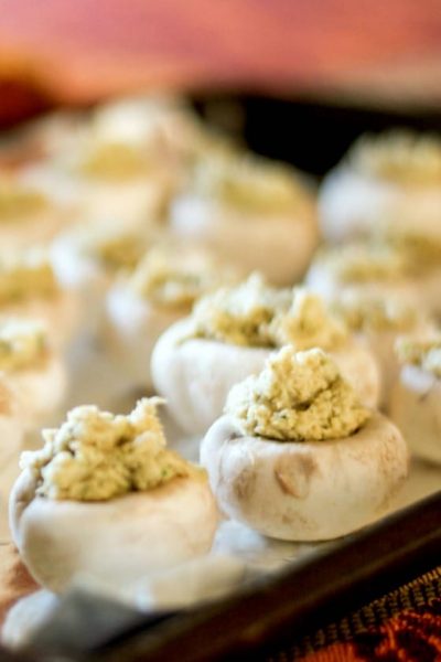 Garlicky Stuffed Mushrooms made with white button mushrooms, garlic, scallions, fresh thyme, buttery crackers are a simple appetizer that's perfect for holiday entertaining or game day snacking. 