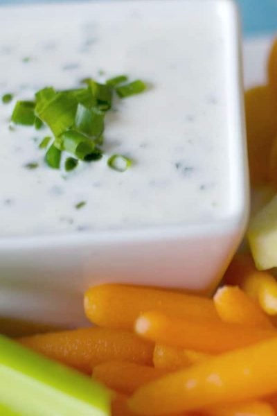 A close up of a plate of food with broccoli, with Buttermilk and Ranch Dressing