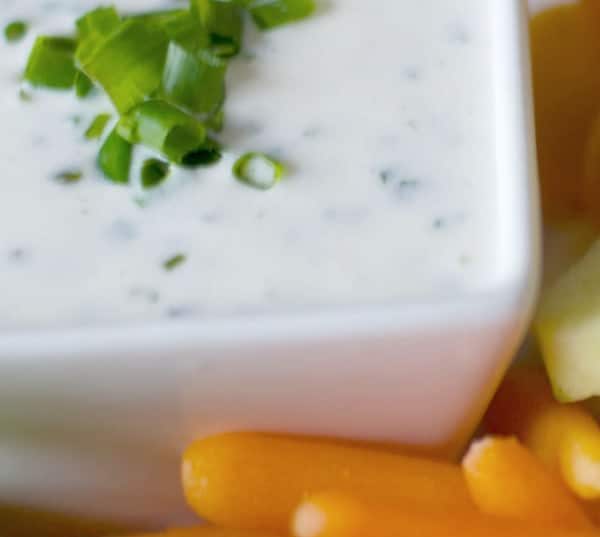 A close up of a plate of food with broccoli, with Buttermilk and Ranch Dressing