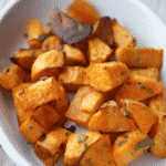 Fresh sweet potatoes tossed with sage and extra virgin olive oil; then roasted until sweet and golden brown makes a tasty side dish.