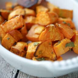 Roasted sweet potatoes in a white baking dish