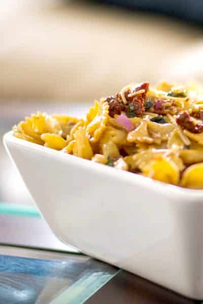 Sun Dried Tomato and Asiago Cheese Pasta Salad in a white square bowl
