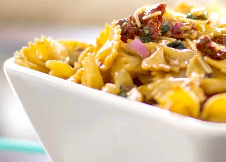 Sun Dried Tomato and Asiago Cheese Pasta Salad in a white square bowl