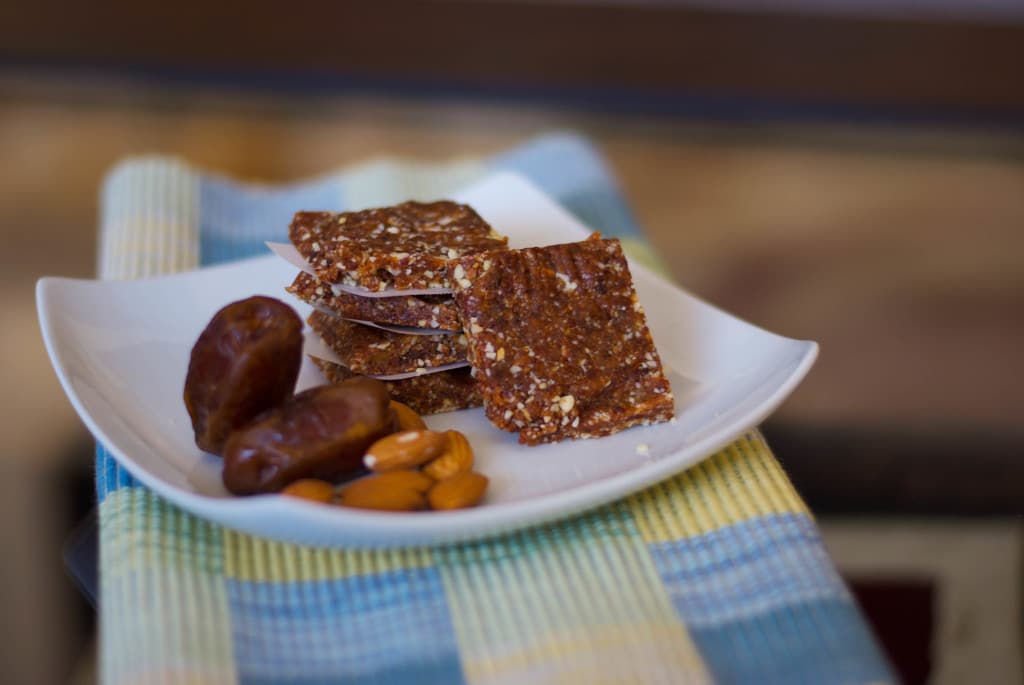 Energy Bars with dates on a white plate. 