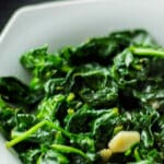 Fresh spinach sautéed with olive oil and garlic; then lightly seasoned with salt and pepper. It's so easy, yet goes with any meal!