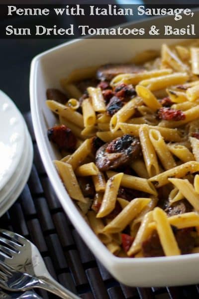 A bowl of food, with Sausage and Penne