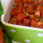 Bruschetta made with tomatoes, basil, onion, garlic and cheese in a balsamic vinaigrette makes a delicious appetizer or afternoon snack.