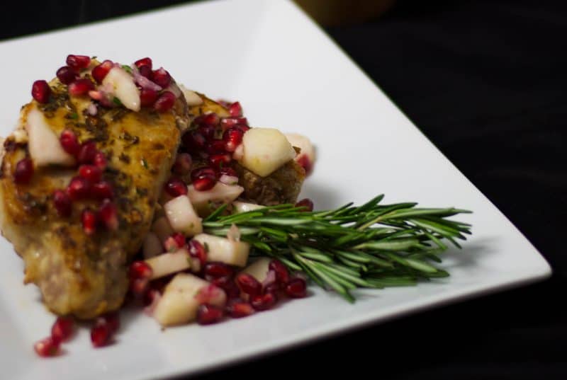 A plate of food on a table, with Pork and Salsa