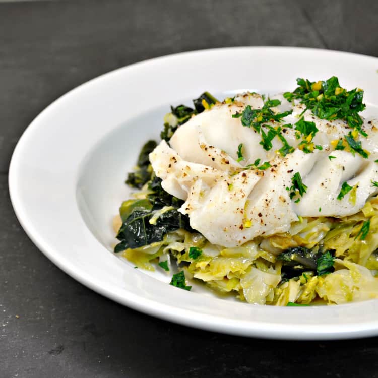 A plate of food with broccoli, with Cod and Salad