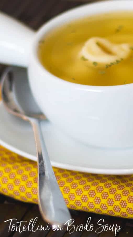 A cup of Tortellini en Brodo Soup