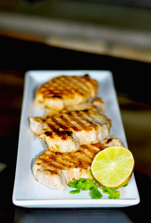 Boneless, center cut pork chops marinated in a brine of fresh lime juice and cilantro; then grilled to perfection.