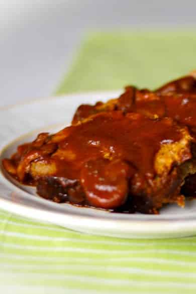 Meatloaf made with lean ground beef, mushrooms and spices in at tomato based sauce.